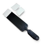 Black paddle with three white squares on a white background